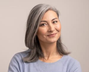 Woman smiling with gray hair